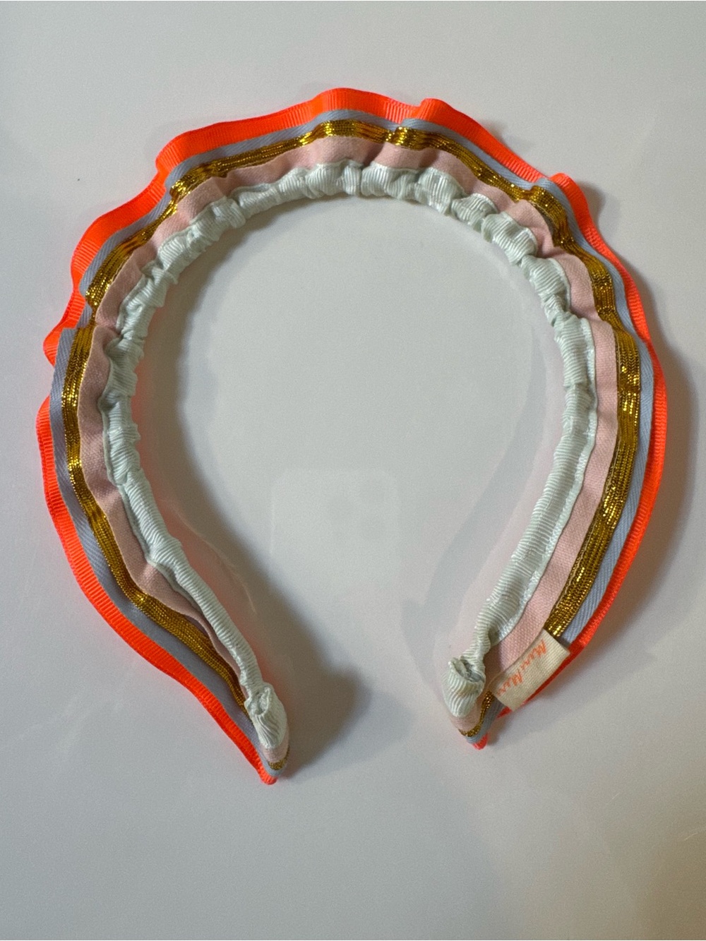 Meri Meri Neon Orange Trim Multicolor Ruffled Headband with metallic gold trim